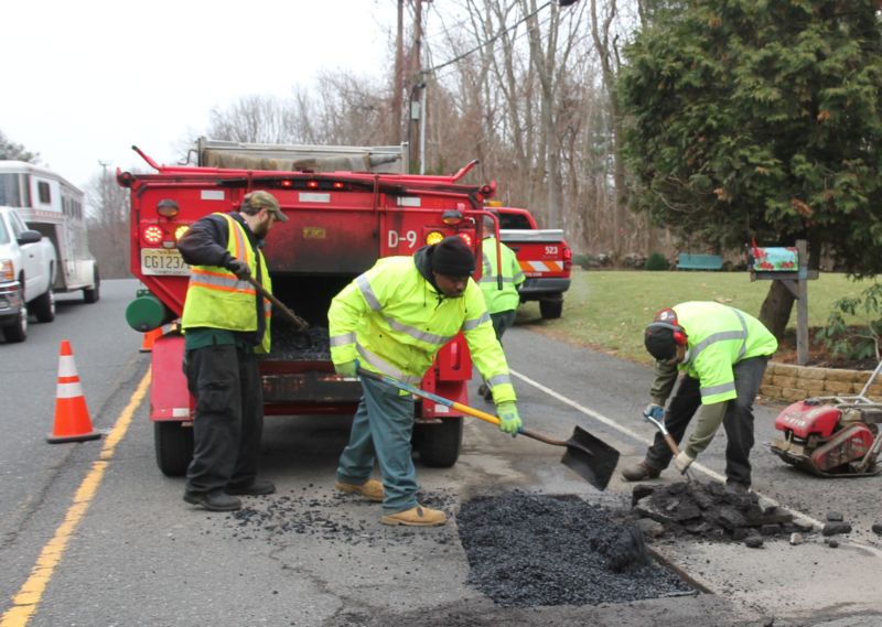 Monmouth County Public Works Highway crews repair potholes on County roads.